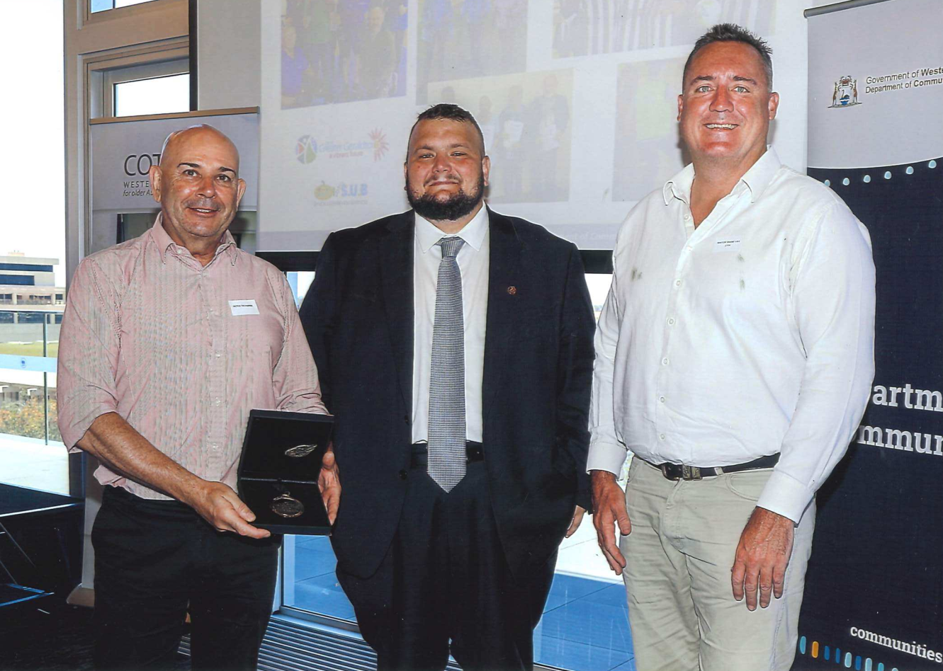 City of Greater Geraldton Coordinator Community Development Peter Treharne, Hon Kyle McGinn MLC with Mayor Shane Van Styn accepting the award for Age Friendly Local Government