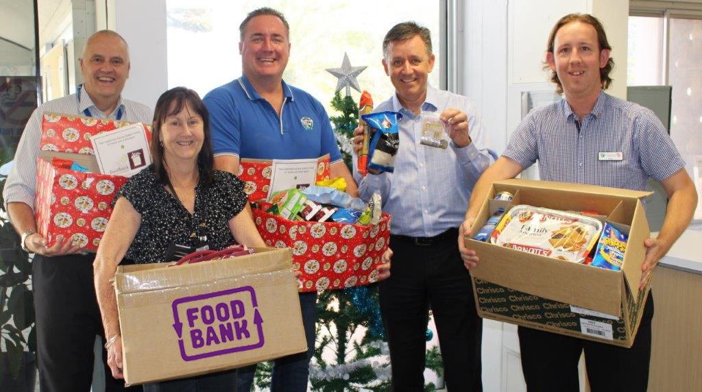 City staff donating food and cash to Foodbank