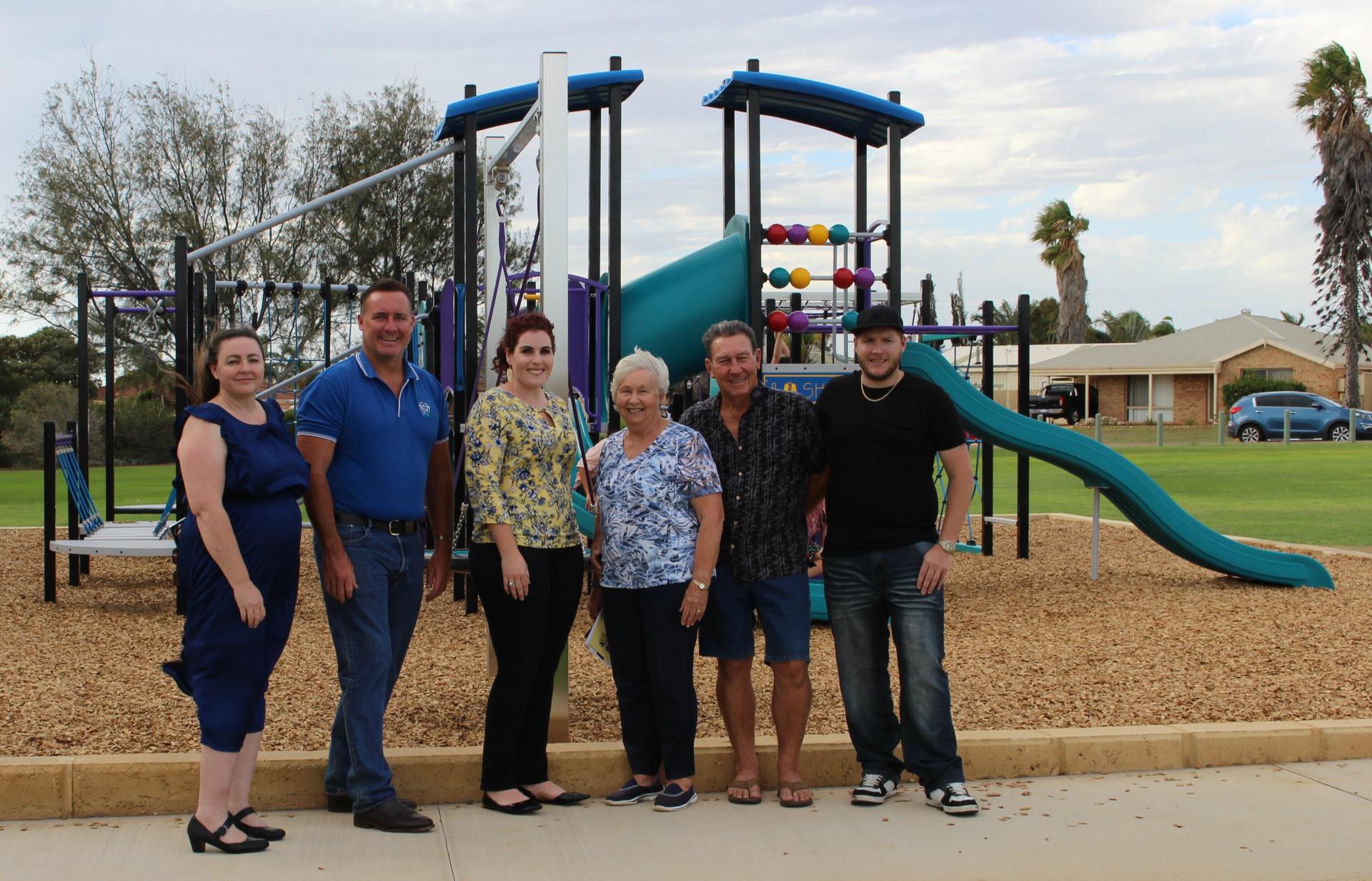 City Mayor Shane Van Styn (second from left) is joined by Waggrakine-Glenfield Progress Association Executive members (from right) President Dillon Godden, Des Pike, Marg Pike, Janelle O’Brien and Carrie Kenning in front of the newly replaced playground equipment at Forrester Park in Waggrakine.