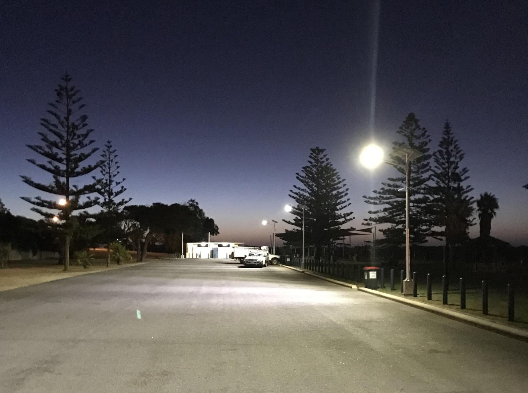 Pages Berach carpark lit at night