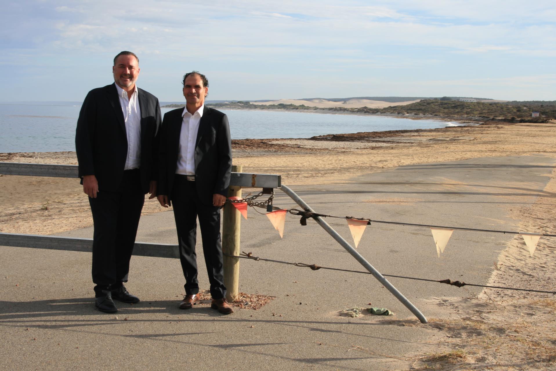 City of Greater Geraldton Mayor Shane Van Styn (left) and Drummond Cove Progress Association President Gavin Hirschhausen at fence around the Whitehill Road Coastal reserve which will be replaced with bollards and rails.